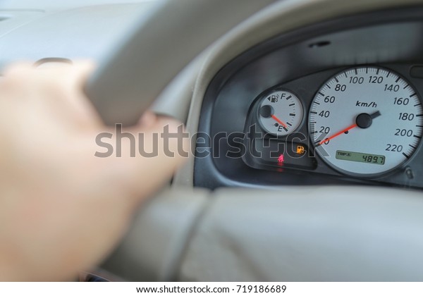 Driving\
with digital safety belt sign and digital oil gasoline level sign\
on the dashboard indicates that some passengers do not fasten\
safety belt and the oil gasoline is running\
low.