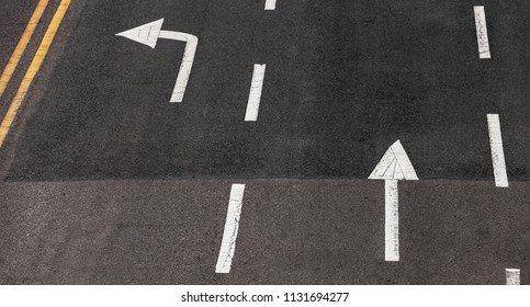 Driving Directions By Lanes. White Arrows And Lines, Road Marking Over Dark Highway Asphalt