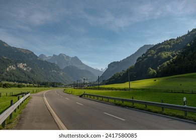 Driving down an empty road. Highway in mountains. Car driving on road. Road landscape. Car trip. Destination
