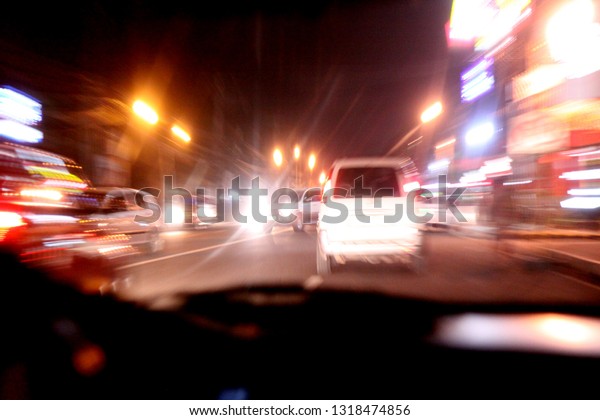 Driving fast at night in the\
city