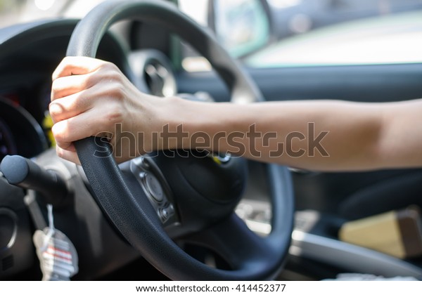 Driving, Hand grab on the\
wheel.