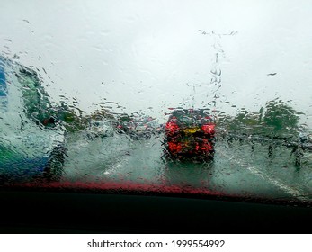 Driving With Heavy Rain On Car Windscreen And Poor Visibility.