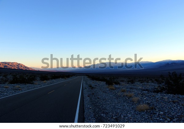 driving in the historical route 66 near Death Valley\
in Nevada in USA