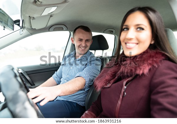 Driving Instructor and Female Student in\
Examination Car Testing Learner\
Driver