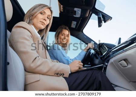 Driving Instructor Observing Student During Road Test