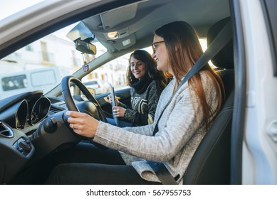 Driving instructor teaching  a student.