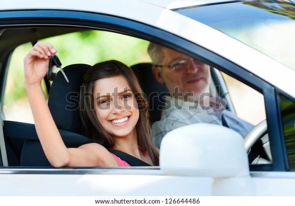 driving\
instructor teaching student learner\
driver