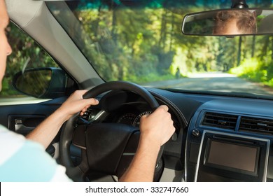 Driving Man Sitting Inside The Car  In Redwood, US