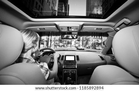 young women enjoying vacation in the car on road trip