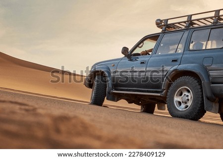 Driving Off Road At A Desert 