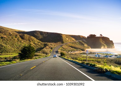 Driving on Highway 1 on the Pacific Ocean coastline close to Half Moon Bay, California