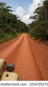 Driving On Red Dirt Road N17 Between Kribi And Ebolowa, Cameroon, Africa.