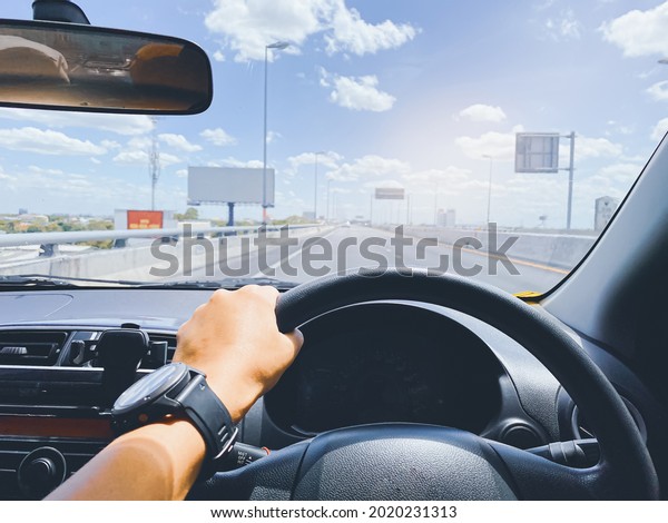 driving on the road,\
drivers point of view.