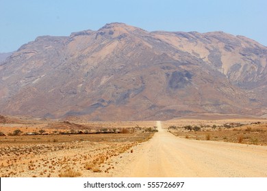 Driving open dirt road, dusty gravel track and offroad to the Brandberg, highest mountain peak of Namibia, Damaraland, Africa - Powered by Shutterstock