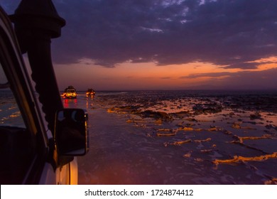 Driving Over Salt Flats By 4x4 At Night In Danakil Desert, Ethiopia