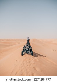 Driving Quad In The Desert Of Dubai