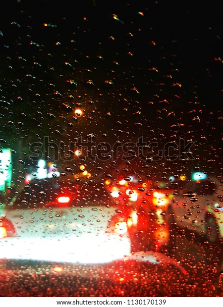 Driving in rain and focus\
at window. 