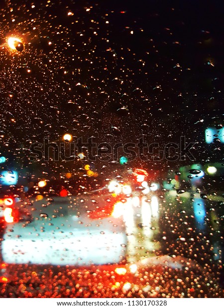 Driving in rain and focus\
at window. 