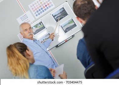 Driving School - Driving Instructor In His Class