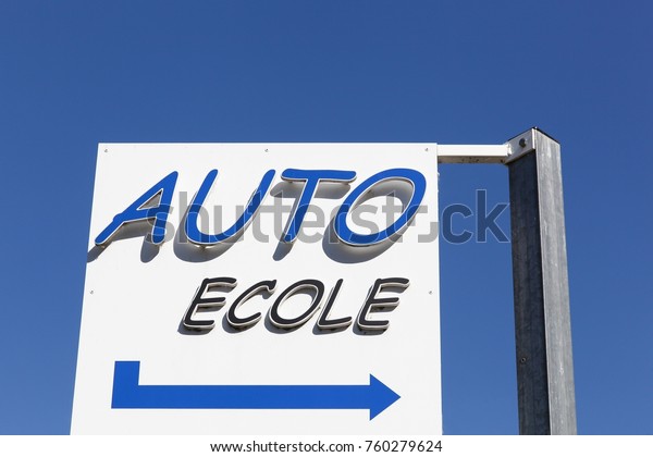 Driving\
school sign called auto ecole in French\
language