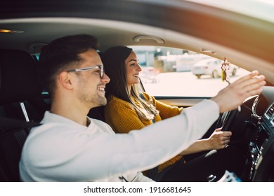 Driving School Or Test. Beautiful Young Pregnant Woman Learning How To Drive Car Together With Her Instructor. 