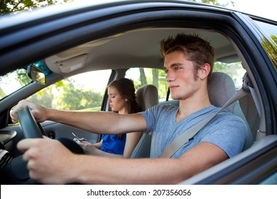 Driving: Smart Male Teen Driver Paying Attention To Road