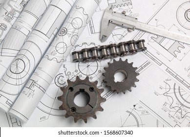 Driving sprockets, chain and engineering drawings of industrial parts and mechanisms