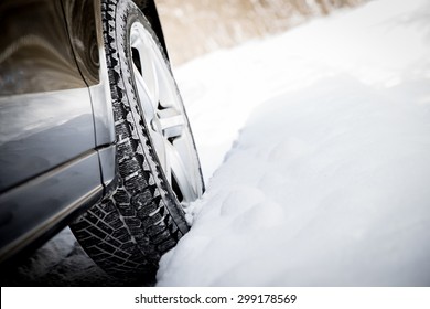 Driving SUV Car In Winter On Forest Road With Much Snow