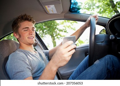 Driving: Teen Male Distracted By Text Messaging