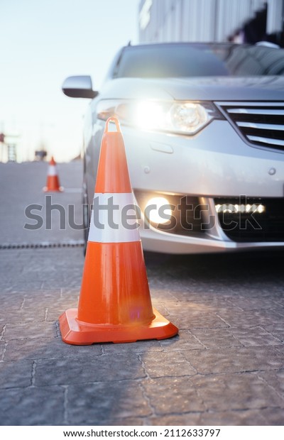 Driving Test.\
Training parking, practice a skill. Cones for the examination,\
driving school concept.