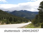 driving through the rocky mountains on peak to peak highway