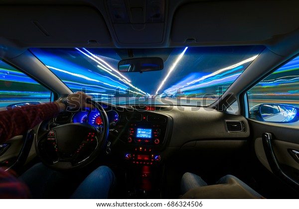 DRIVING IN THRU NIGHT, Blured road with lights with\
car on high speed