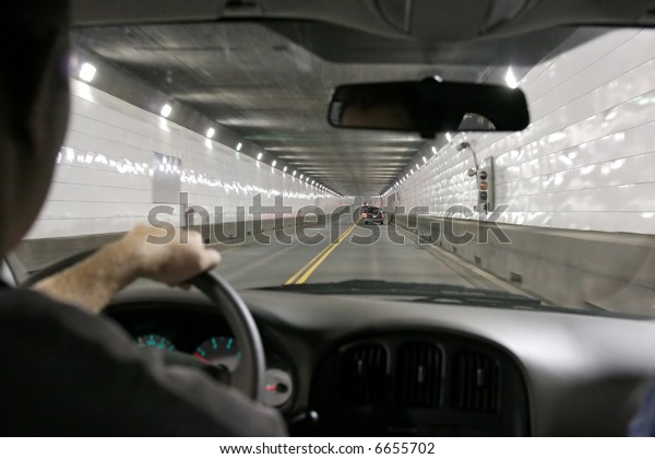 Driving in a tunnel, between US and Canada,\
Detroit Michigan and Windsor\
Ontario