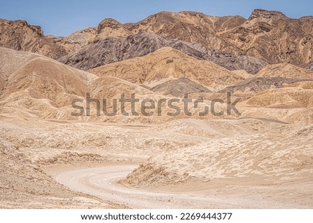 Driving in Twenty Mule Team Canyon, the desert road from Star Wars, Death valley, California