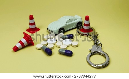 Driving Under the Influence Concept with Capsules Pills Handcuffs Traffic Cone and Car Symbolizing Drug Impairment Law Enforcement Risk. 