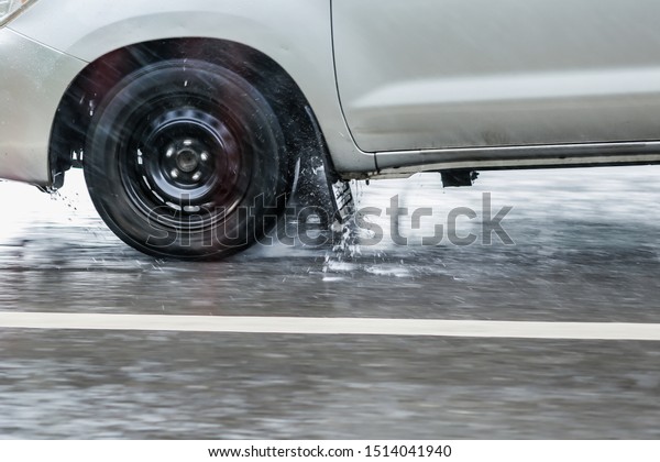 Driving under wet road\
conditions,Road accident that occurred One reason is that it occurs\
during the rain, slippery roads,blur,Soft focus,selective\
focus.