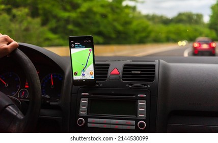 Driving Using Waze Maps Application 260nw 2144530099 