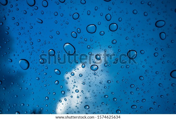 The\
drizzle on glass of car  from the sky in\
afternoon