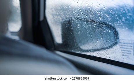 Drizzle On The Windsheild, Car Wipers, Inside Car When Rainning, Road View Through Car Window With Rain Drops.

