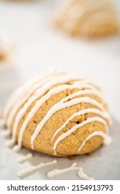 Drizzling Melted White Chocolate Over Freshly Baked Eggnog Scones.