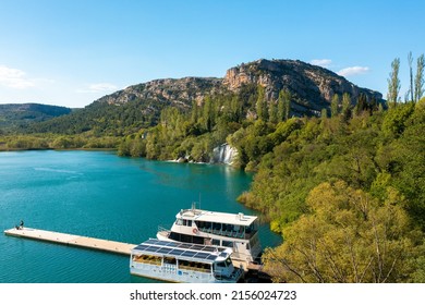 Drnis, Croatia, 04-15-2022: Aerial view of the tourist boats near Roski slap waterfall in Krka National Park, Croatia