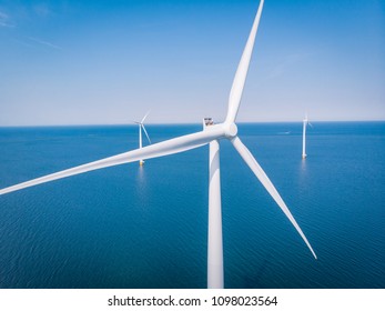 Droen View Aerial View At The Blue Ocean With White Windmills, Wind Mill Farm Green Energy 