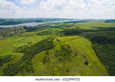 Dron View On Forest And Green Fields With Villade At Lake