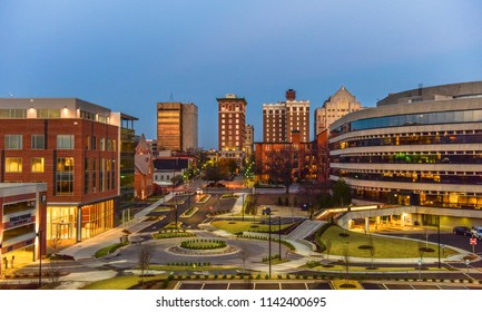 Drone aerial of the downtown Greenville South Carolina SC skyline at sunrise.