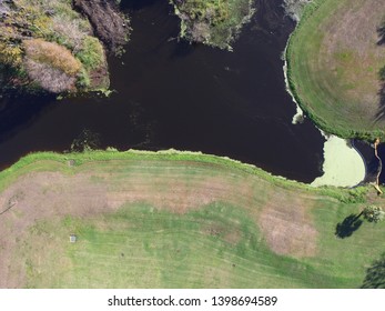 Drone Aerial Image Of An Algae Bloom In A Storm Water Retention Pond In A Suburban Neighborhood Park In Florida