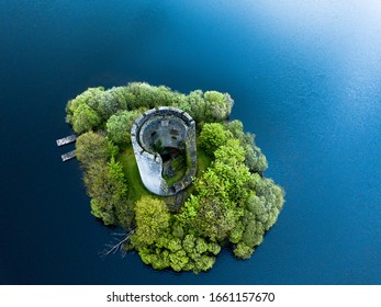 Drone aerial image of Cloughoughter Castle which is a ruined circular castle on a small island in Lough Oughter, 4 kilometres east of the town of Killeshandra in County Cavan, Ireland.