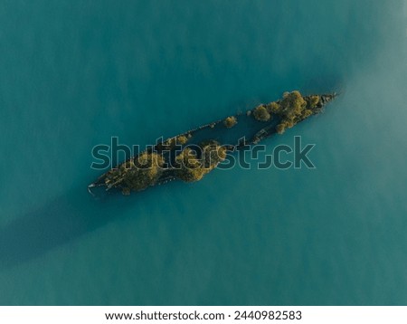 Drone Aerial Image of the S.S City of Adelaide shipwreck on Cockle Bay Magnetic Island in Townsville, Queensland, Australia. Beautiful ocean colors during sunset.