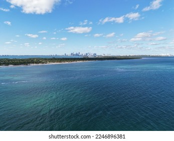 Drone aerial over Key Biscayne with a view of downtown Miami skyline in distance - Shutterstock ID 2246896381