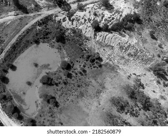 Drone Aerial Over Water Pond Caused By Sapphire Mining In Central Queensland Australia, Sapphire Gemfields. Monotone Image.