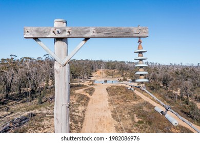 Drone Aerial Photograph Of A Telephone Pole And Wires In A Forest Affected By Bushfires